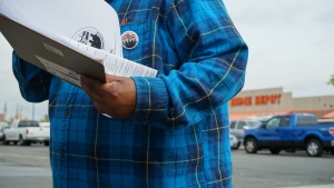 A man holds information about the community organization.