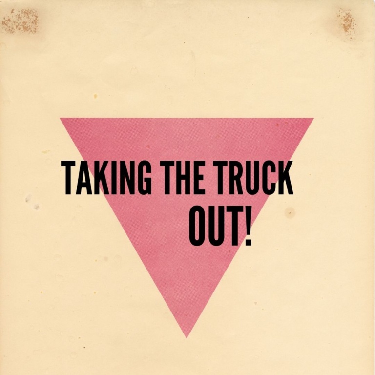 Taking the Truck OUT! written over a pink upside down triangle