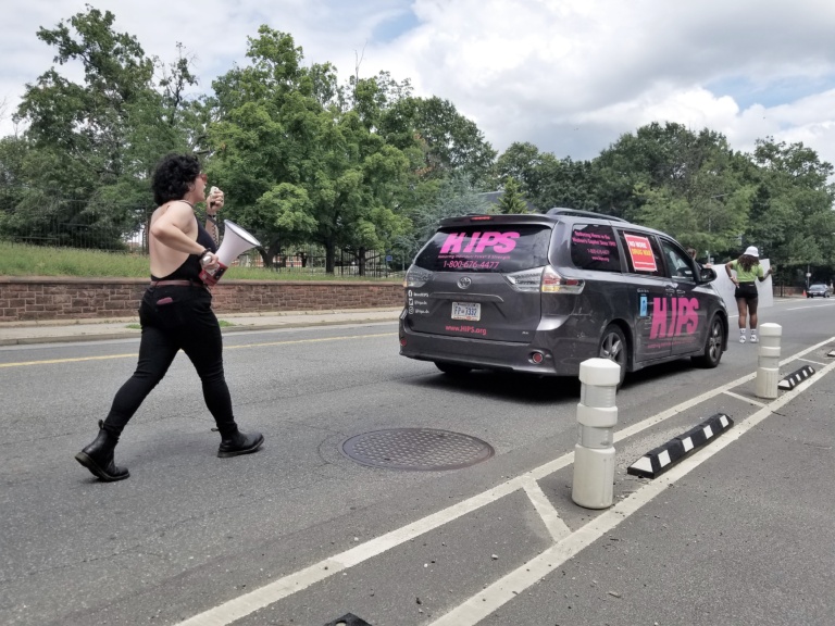 Jessica, harm reduction specialist and organizer of the DC march, leading behind the HIPs van at "Support, Don't Punish". 2021. Photo by Laura Sislen.